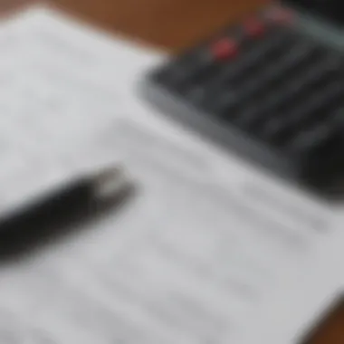 Close-up of financial documents with a calculator and pen