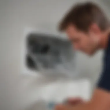 A homeowner thoroughly inspecting the dryer vent for issues