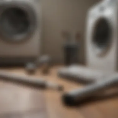 Essential Tools for Dryer Vent Cleaning Tools laid out for dryer vent cleaning including a brush and vacuum