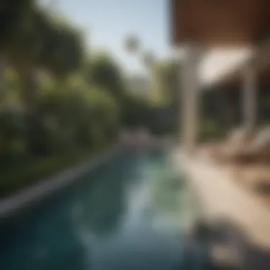 Relaxing Poolside Retreat at Elysian Apartments Luxurious pool area at Elysian Apartments surrounded by lush greenery