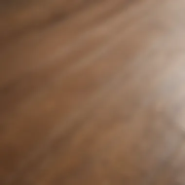 Close-up of laminate flooring surface showing scratches and wear