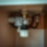 Close-up view of a garbage disposal unit under a sink