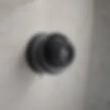 Close-up of a bathtub drain with water pooling around it