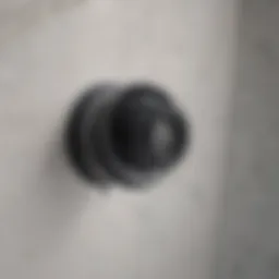 Close-up of a bathtub drain with water pooling around it