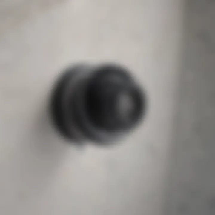Close-up of a bathtub drain with water pooling around it