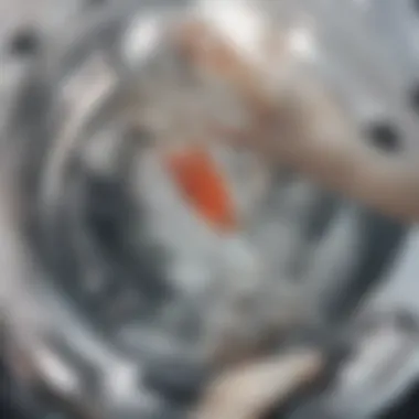 Close-up of vinegar being poured into washing machine