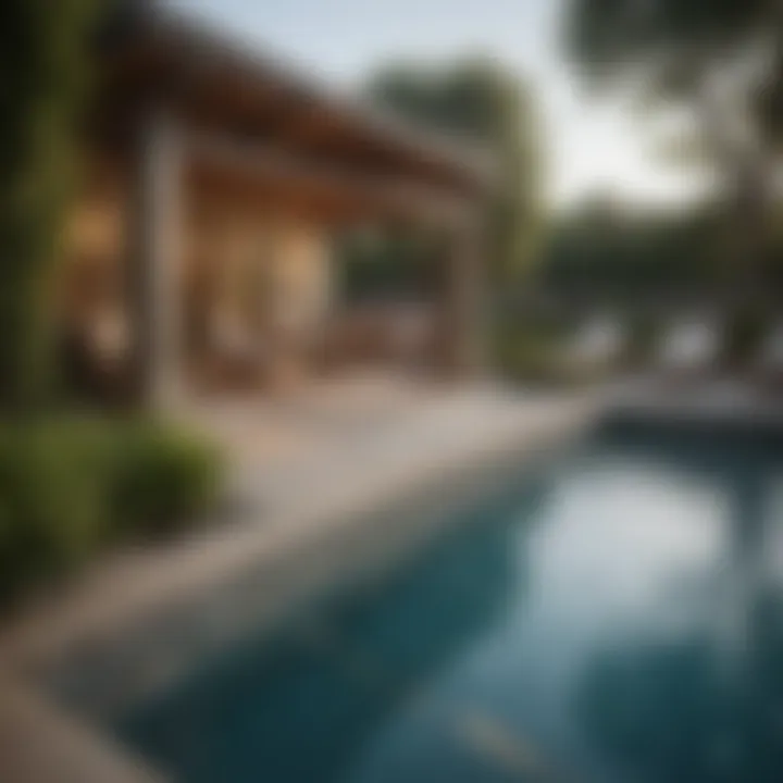 Amenities area featuring a sparkling swimming pool surrounded by greenery
